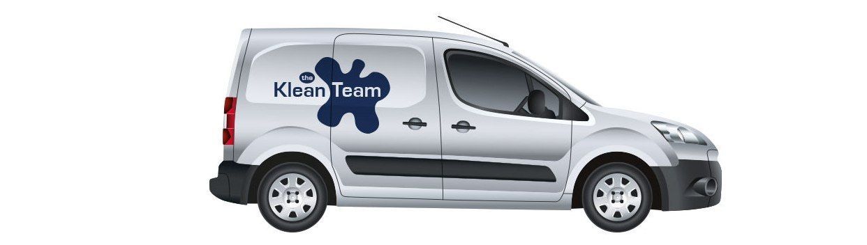 A white van with the word klein team on the side.