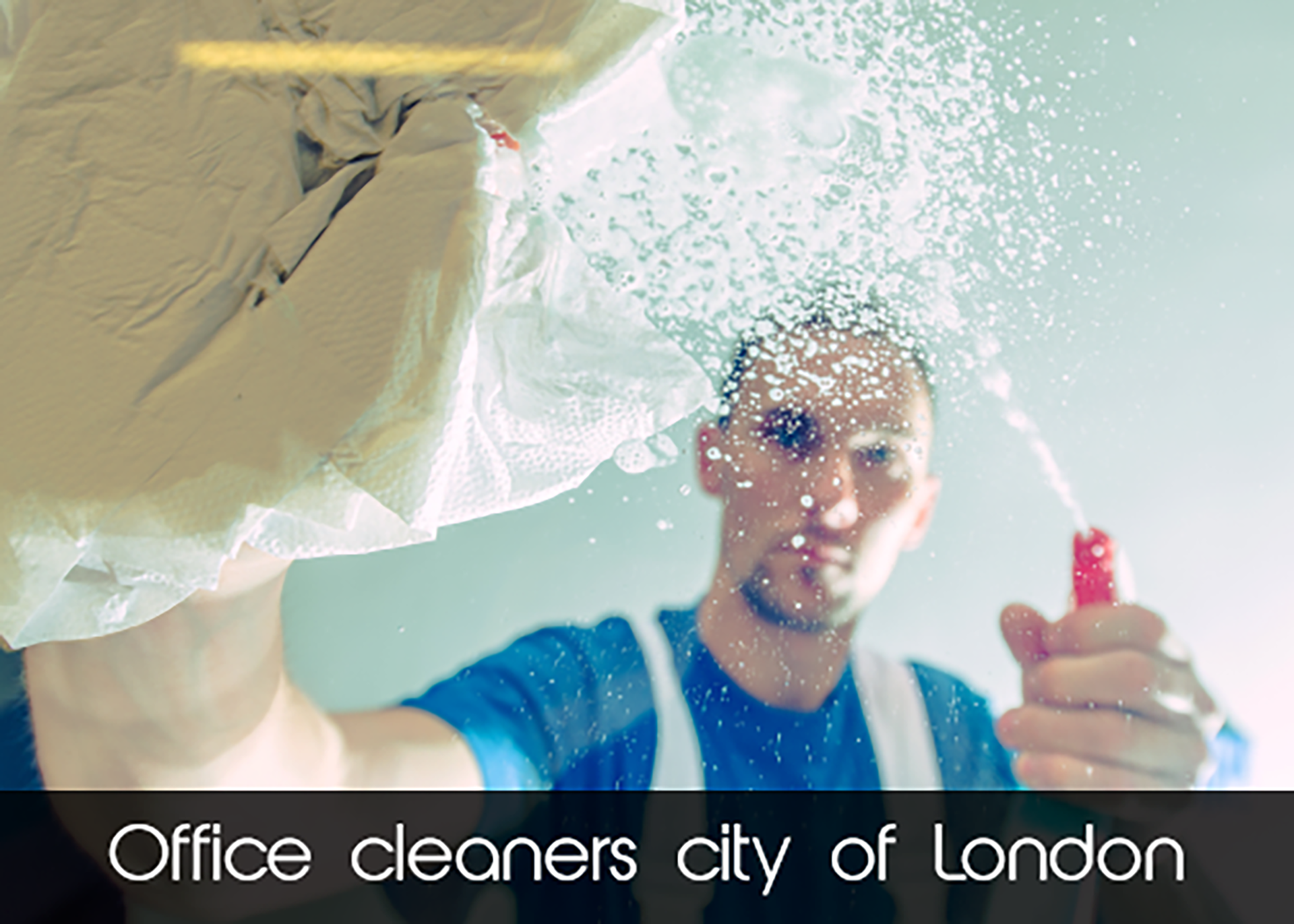 A man is cleaning a window with a spray bottle.