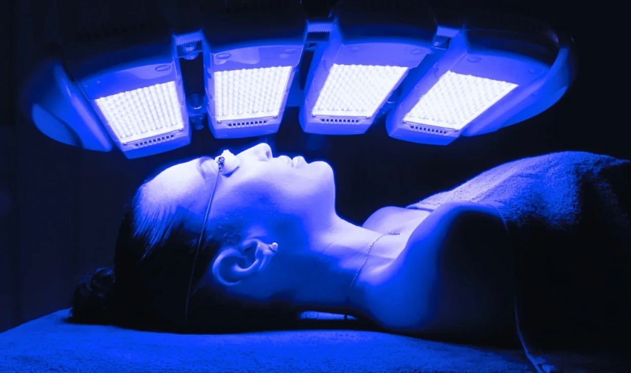 Woman Undergoing Blue Light Therapy Treatment— That Skin Clinic in Mooloolaba, QLD