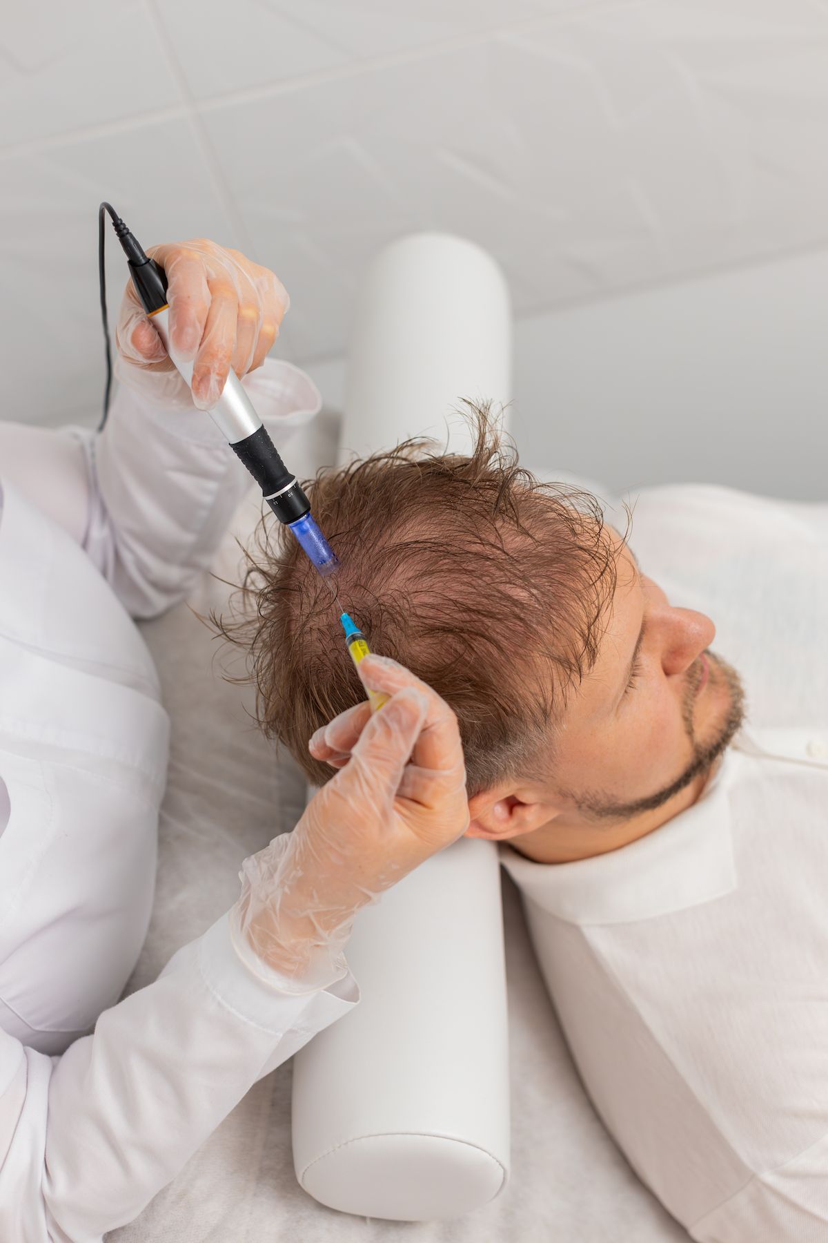 Person Receiving Scalp Treatment; Medical Professional Holding Device — That Skin Clinic in Mooloolaba, QLD