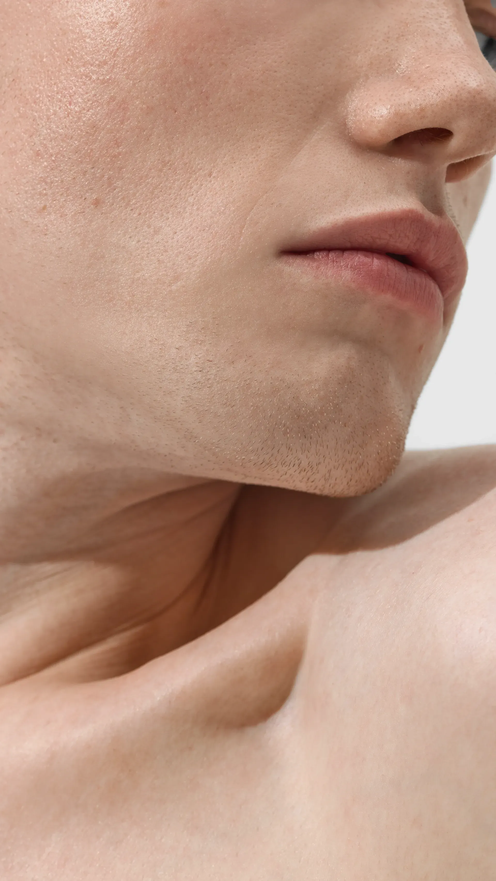 Man Wearing a Gray Beanie and Dark Jacket, Looking Directly at the Camera — That Skin Clinic in Mooloolaba, QLD