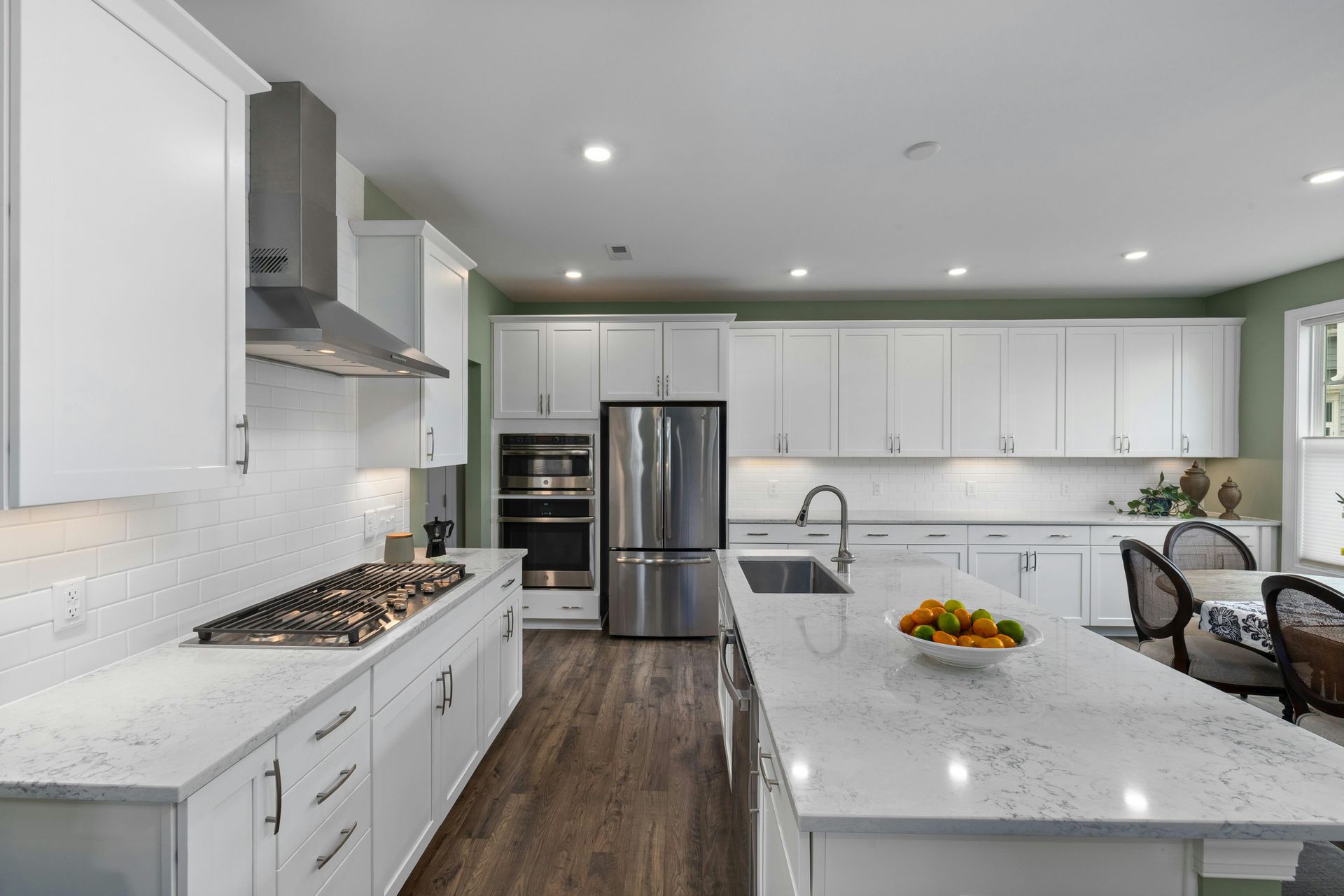 Bright kitchen with white cabinets and a spacious island