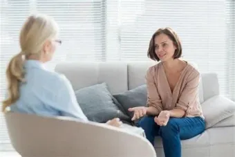 Therapy session with Client and counsellor sat across from each other