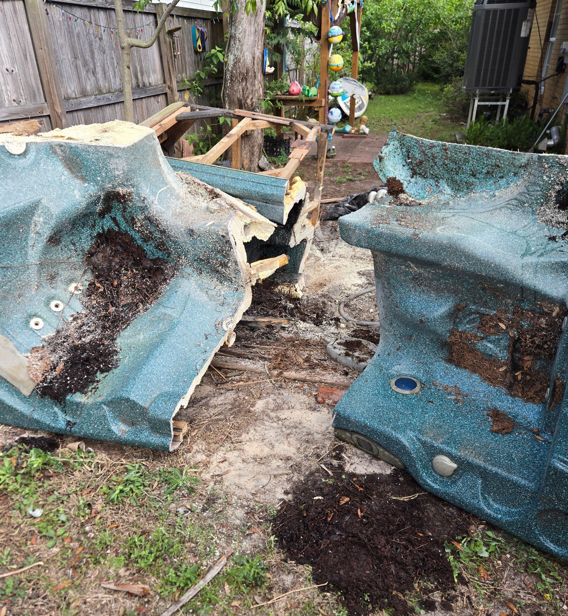 A couple of pieces of blue plastic sitting on top of a dirt field.