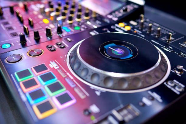 A close up of a dj controller with a record on it.
