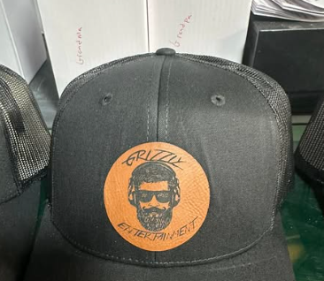 A gift wrapped in brown paper and tied with a gold ribbon