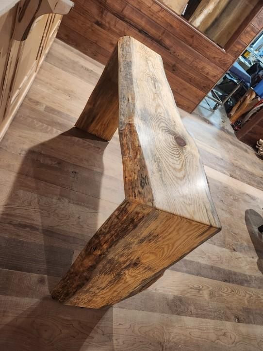 A piece of wood is sitting on top of a wooden floor.