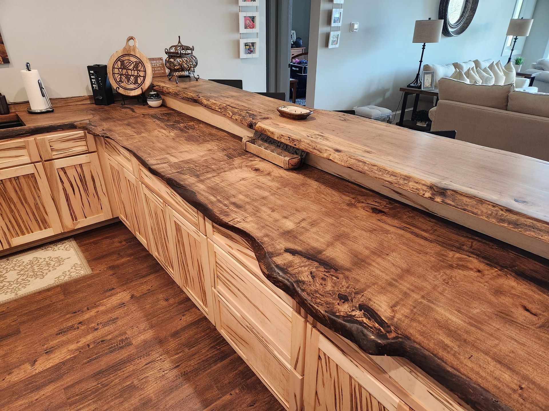 A kitchen with a wooden counter top and cabinets