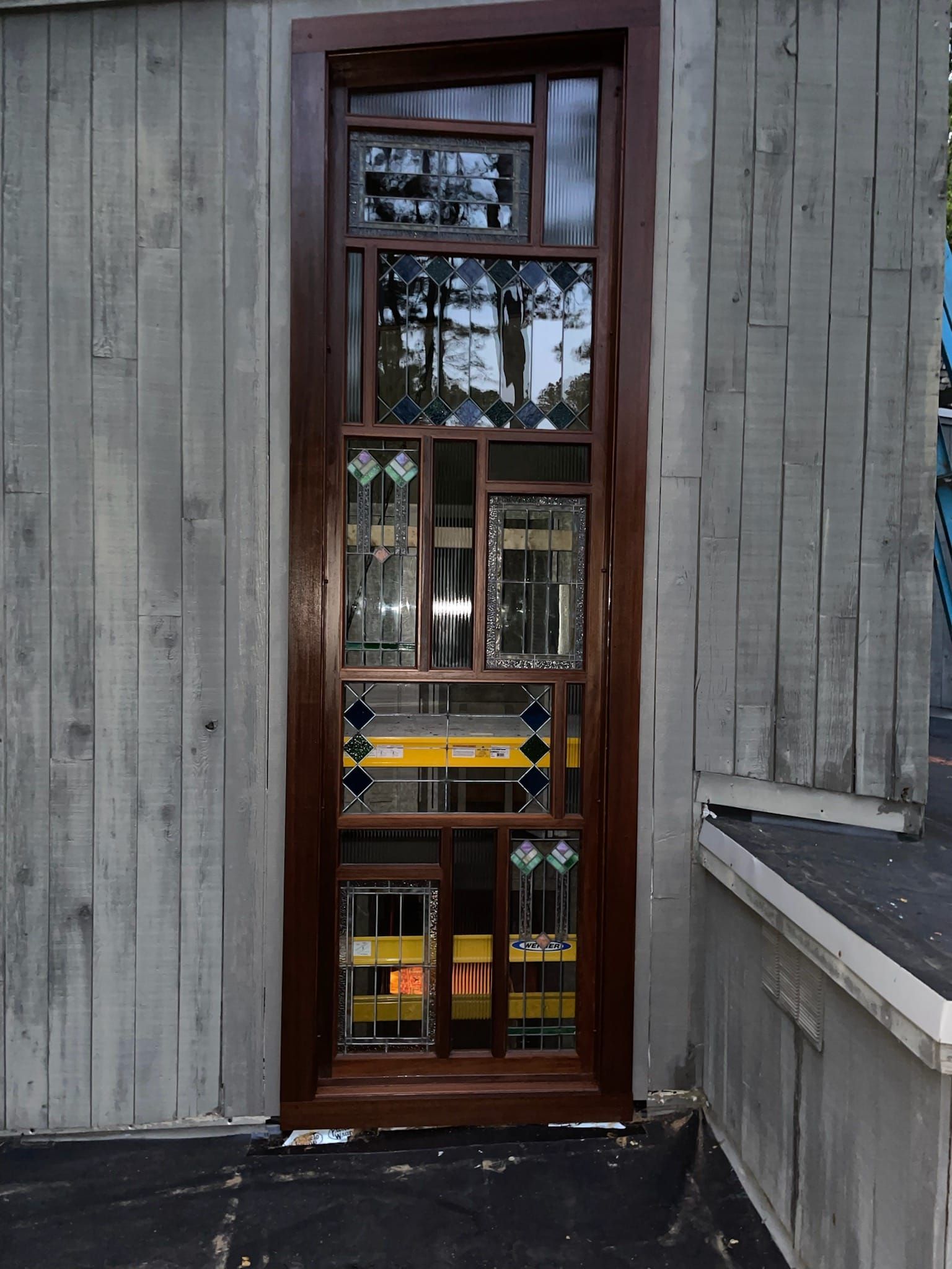 A wooden door with a lot of windows on it