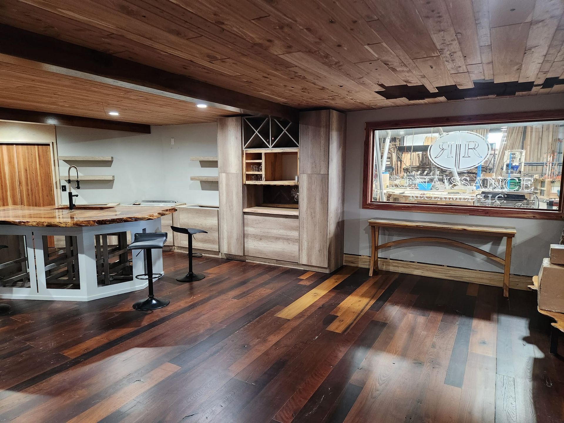 A room with wooden floors and a large mirror