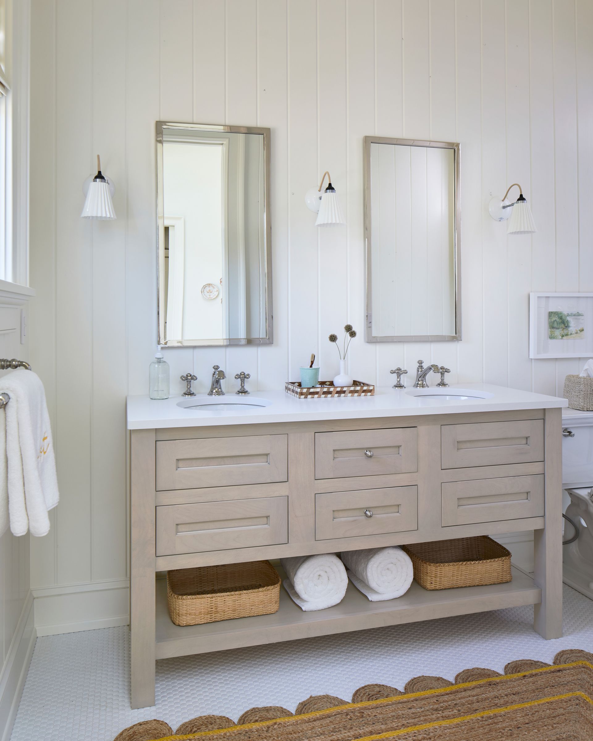 A bathroom with two sinks and two mirrors