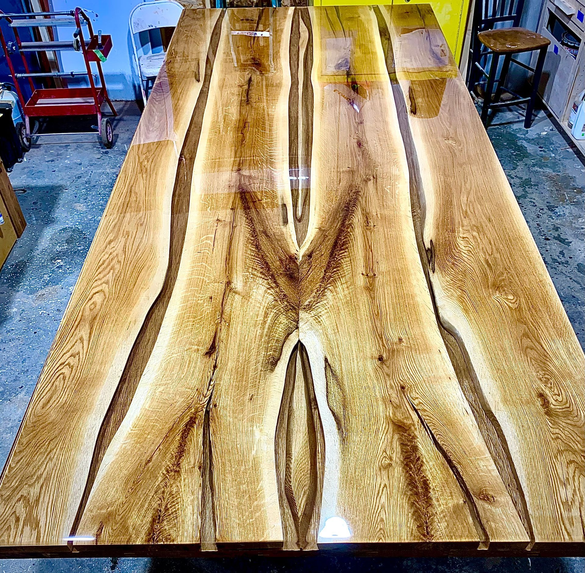 A large wooden table is sitting in a room.