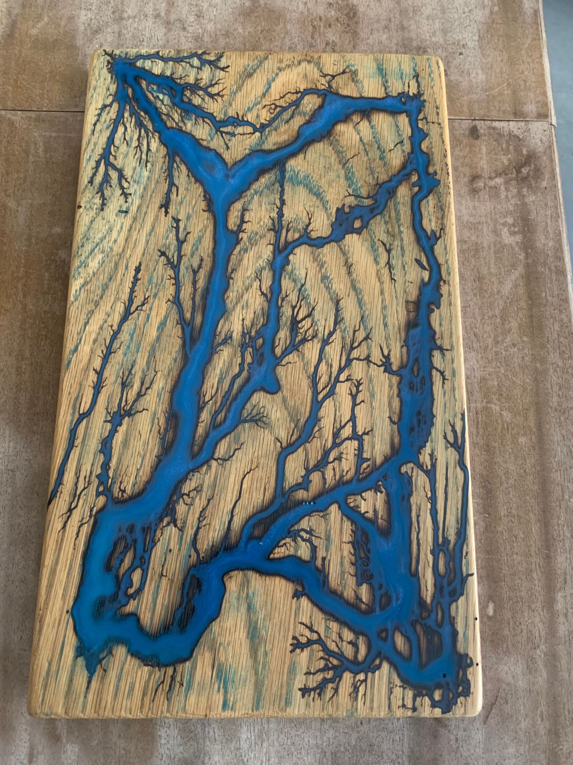 A piece of wood with blue paint on it