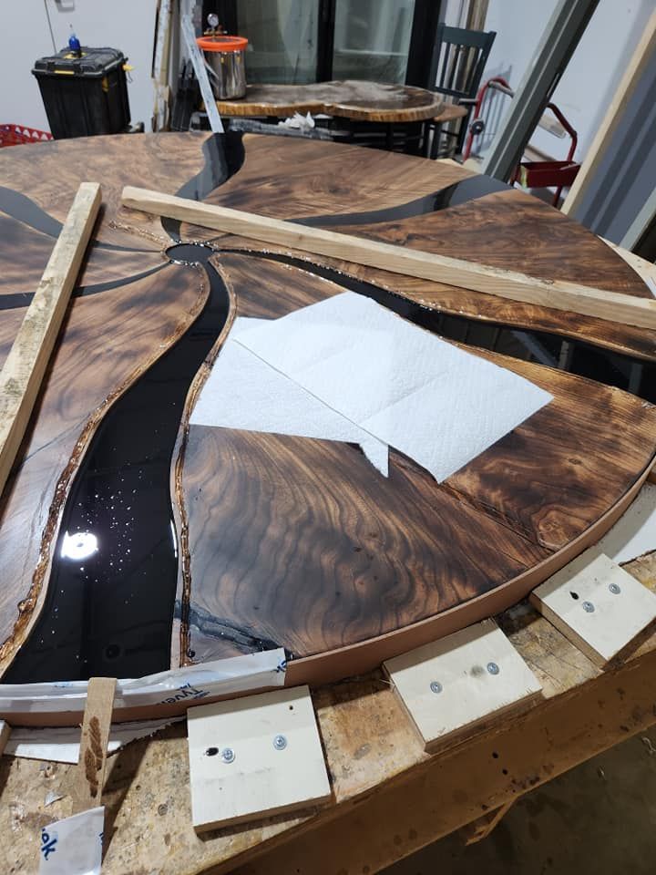A wooden table with a piece of paper on top of it.