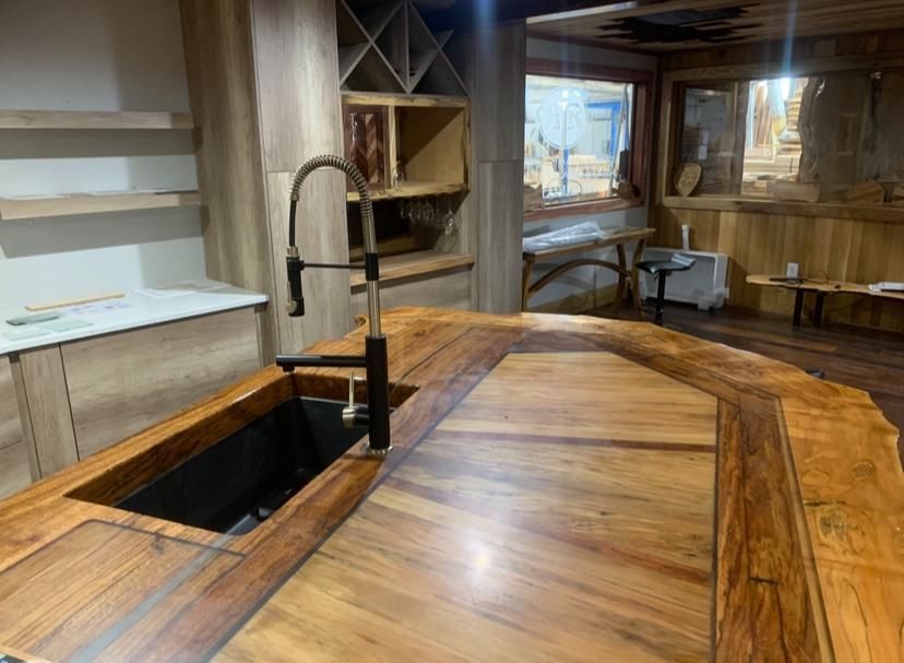 A kitchen with a wooden counter top and a sink.