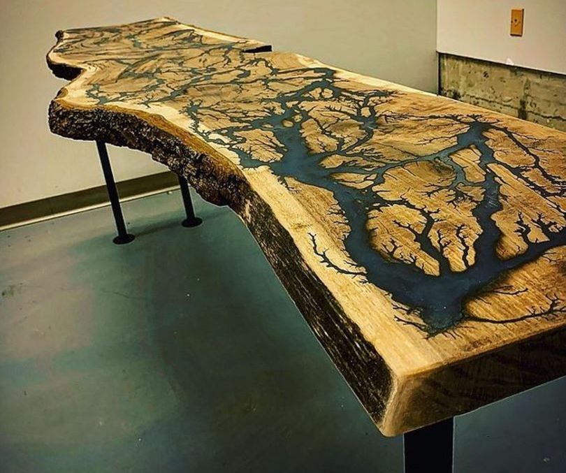 A wooden table with a river coming out of it.