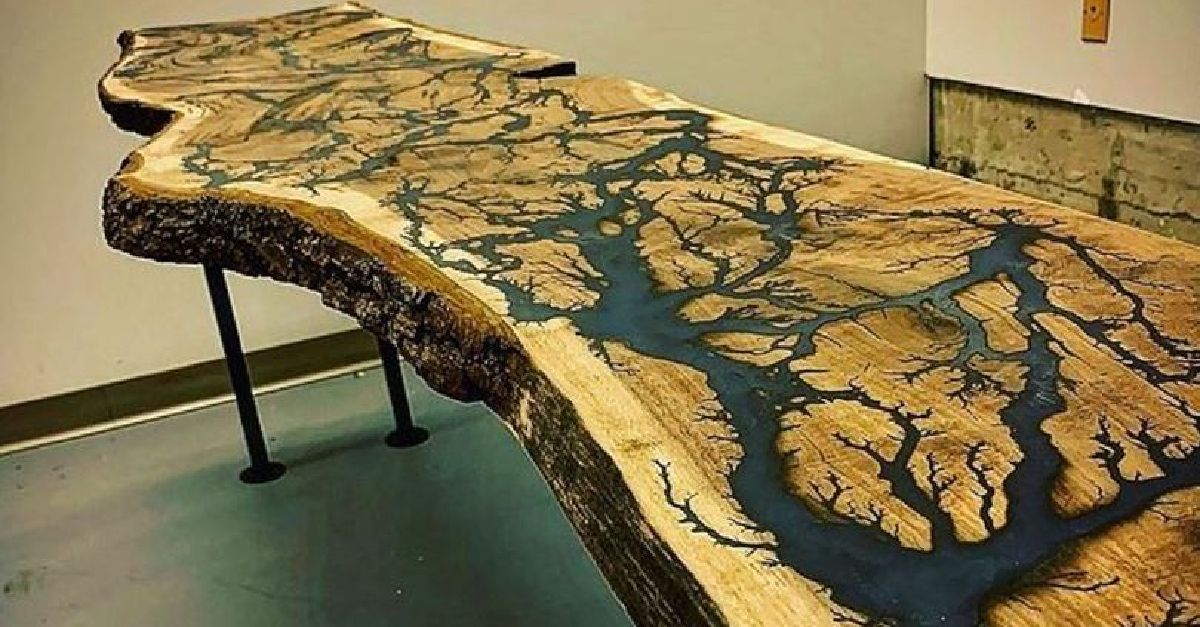 A wooden table with a river in the middle of it.