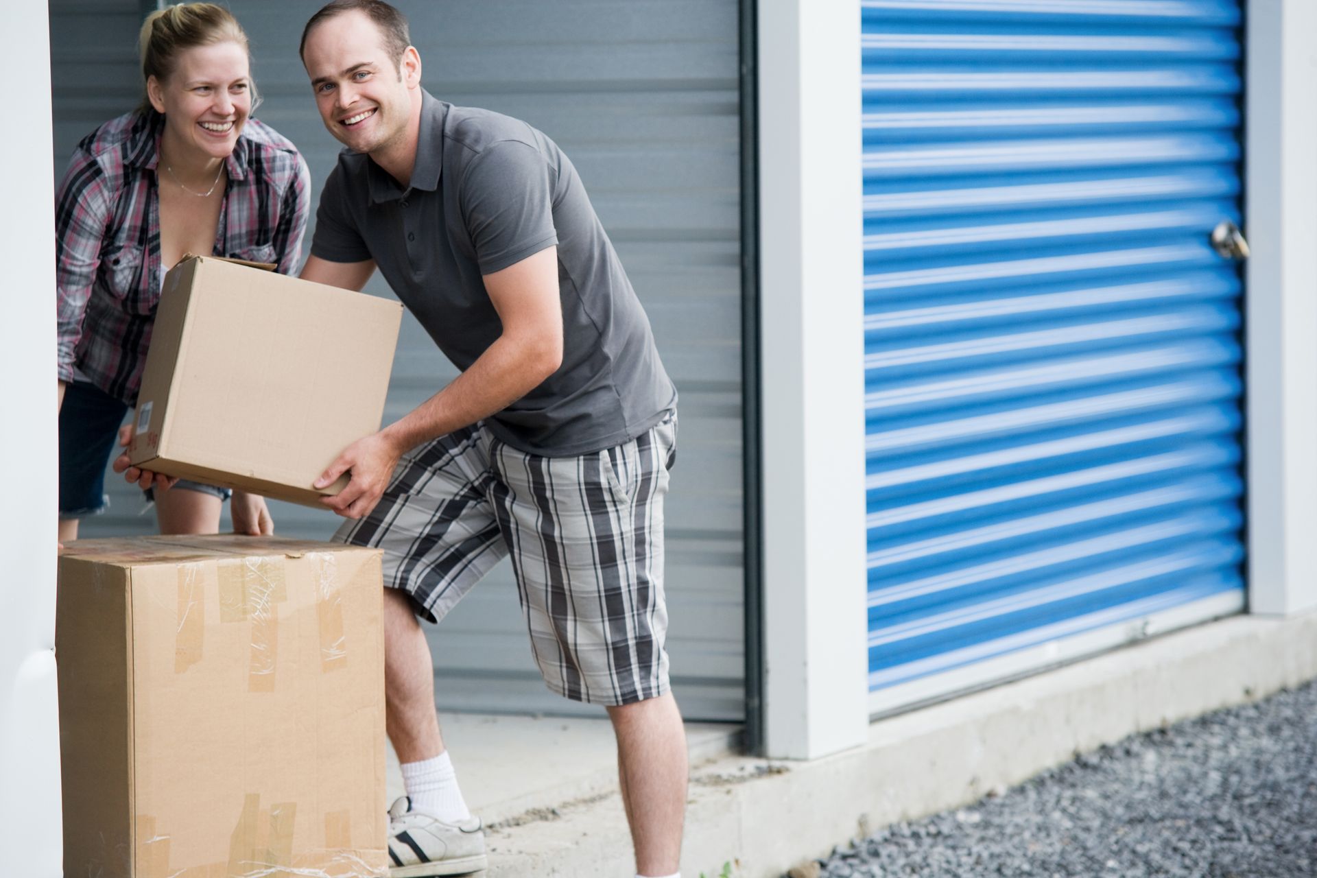 Man and Woman Moving Boxes at Storage Units in Pendleton, in - Secure and Convenient Storage Solutio