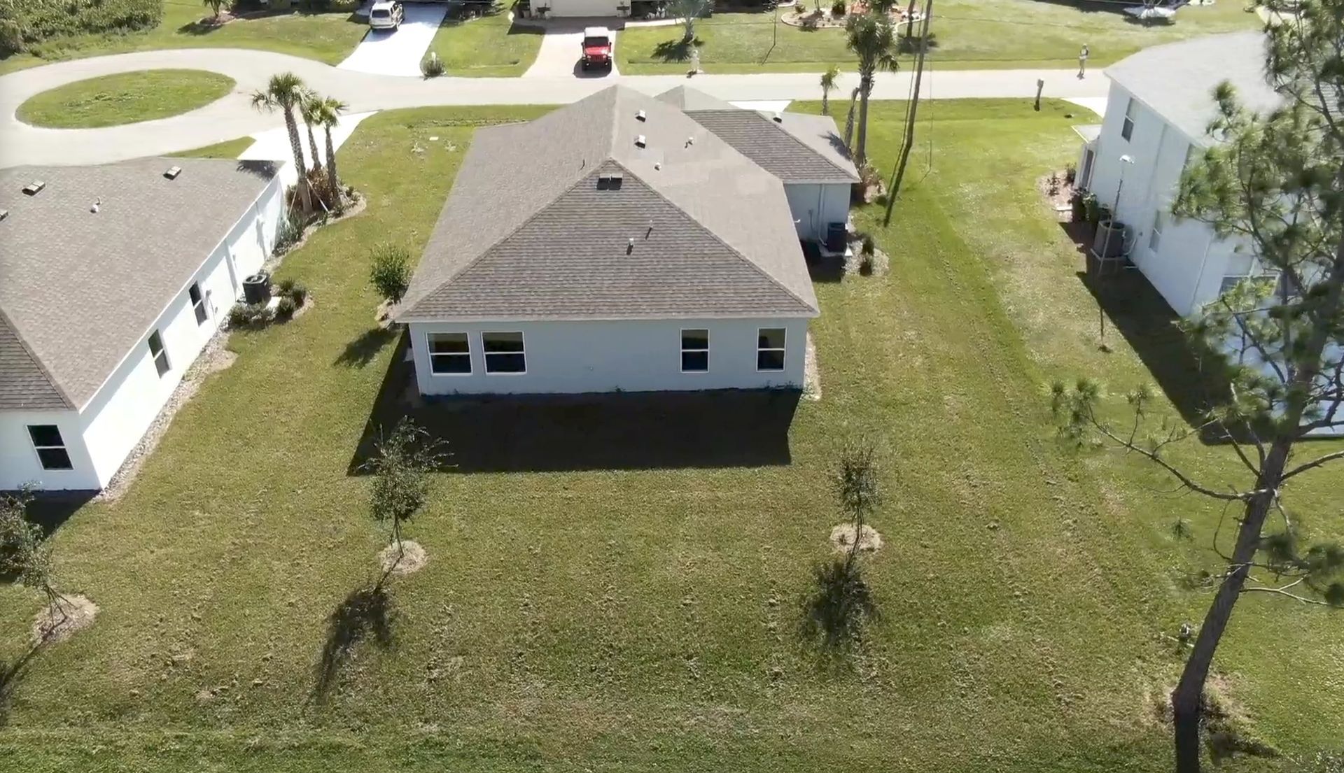 An aerial view of a house in a residential area