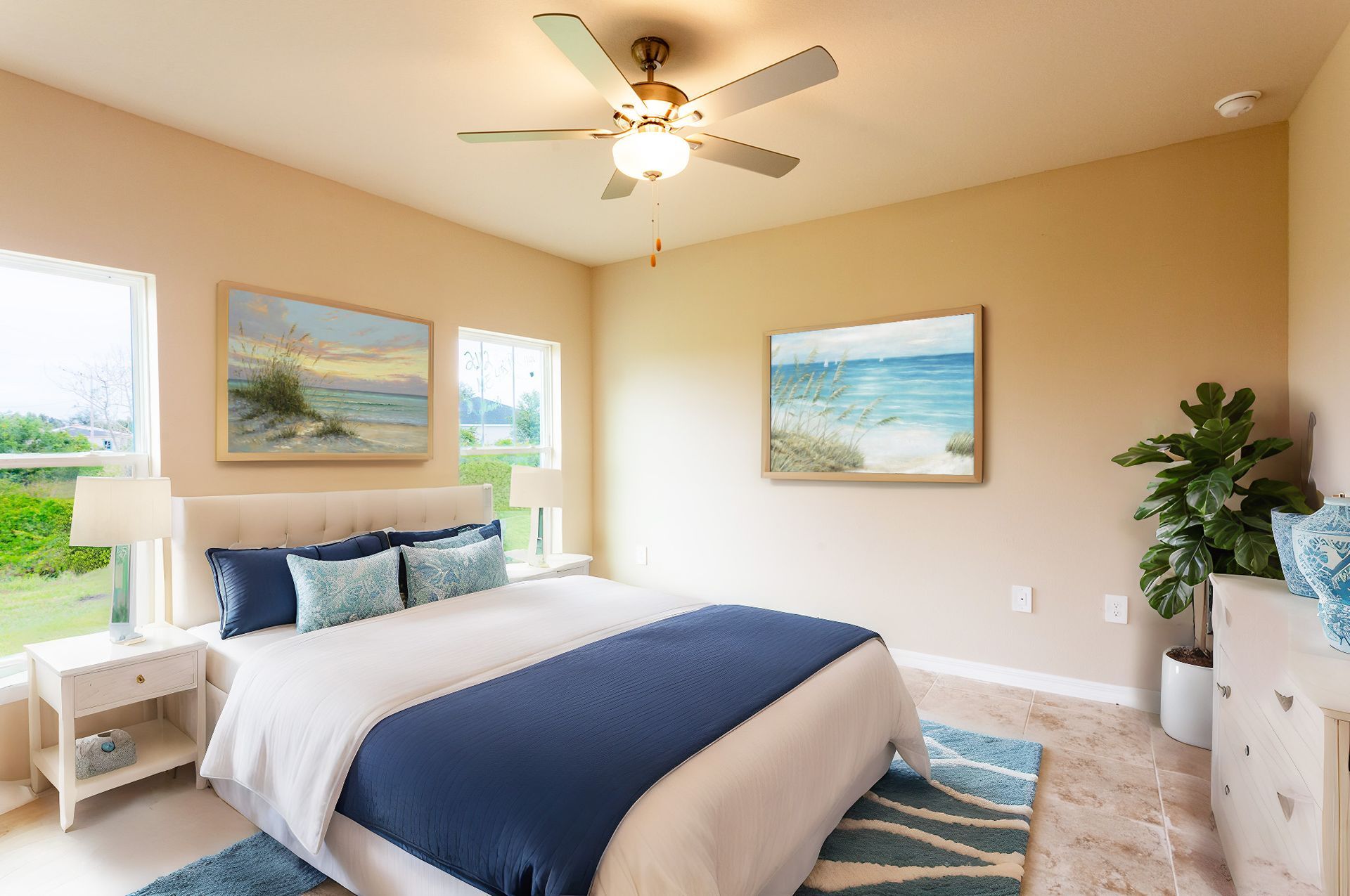 A bedroom with a large bed and a ceiling fan.