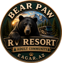 Bear Paw RV Resort logo with bear, mountains, sunset, and trailer in Eagar, AZ
