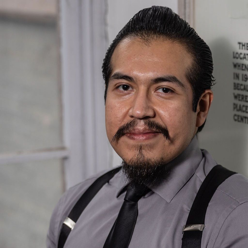 A man in a suit and tie without a face