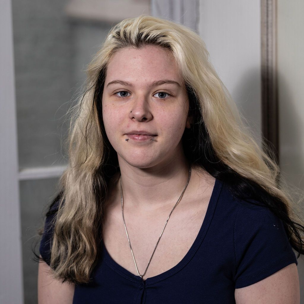 A man in a suit and tie without a face