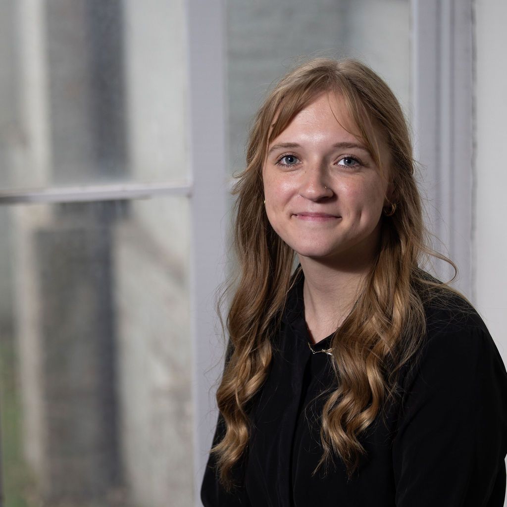 A man in a suit and tie without a face