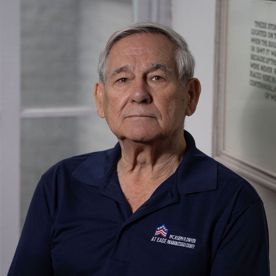 A man in a suit and tie without a face