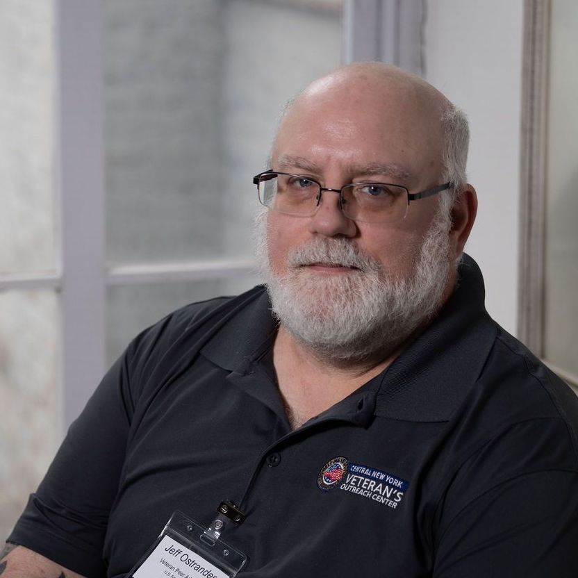 A man in a suit and tie without a face