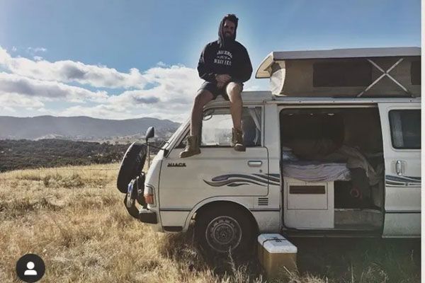 Man sitting on a campervan