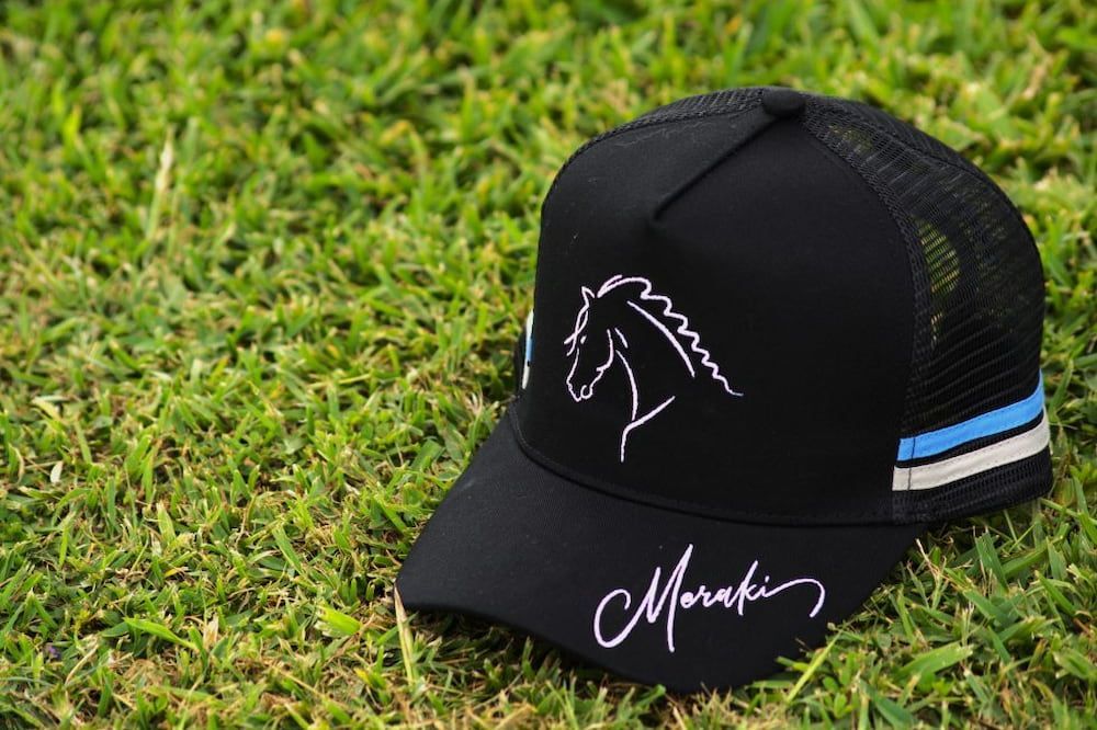 A Woman is Riding a Brown Horse in a Sandy Arena — Meraki Equestrian Centre in Mareeba, QLD