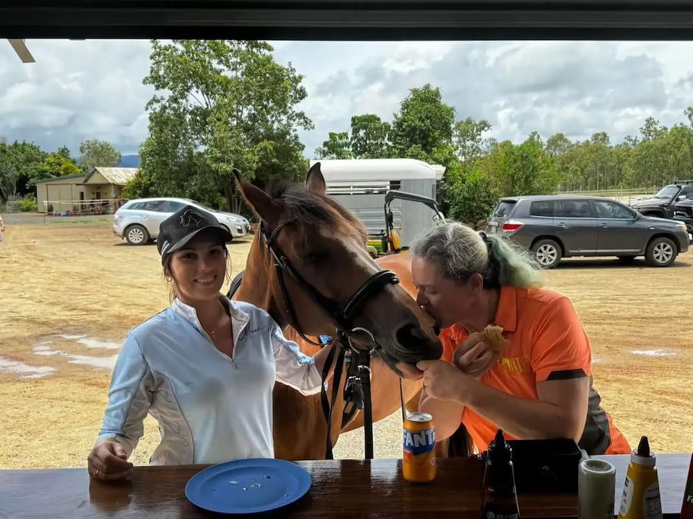 A Man and a Woman Are Standing Next to a Horse — Meraki Equestrian Centre in Mareeba, QLD