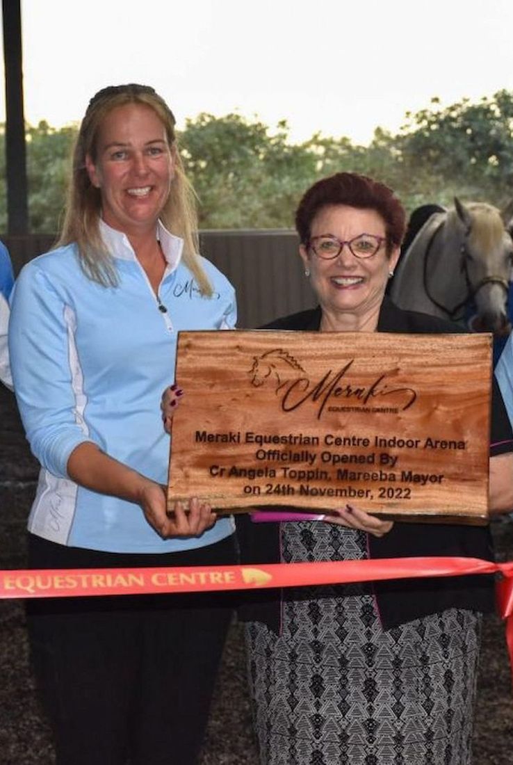 Three Women Wearing Pink Shirts and Hats Are Standing Next to Each Other — Meraki Equestrian Centre in Mareeba, QLD