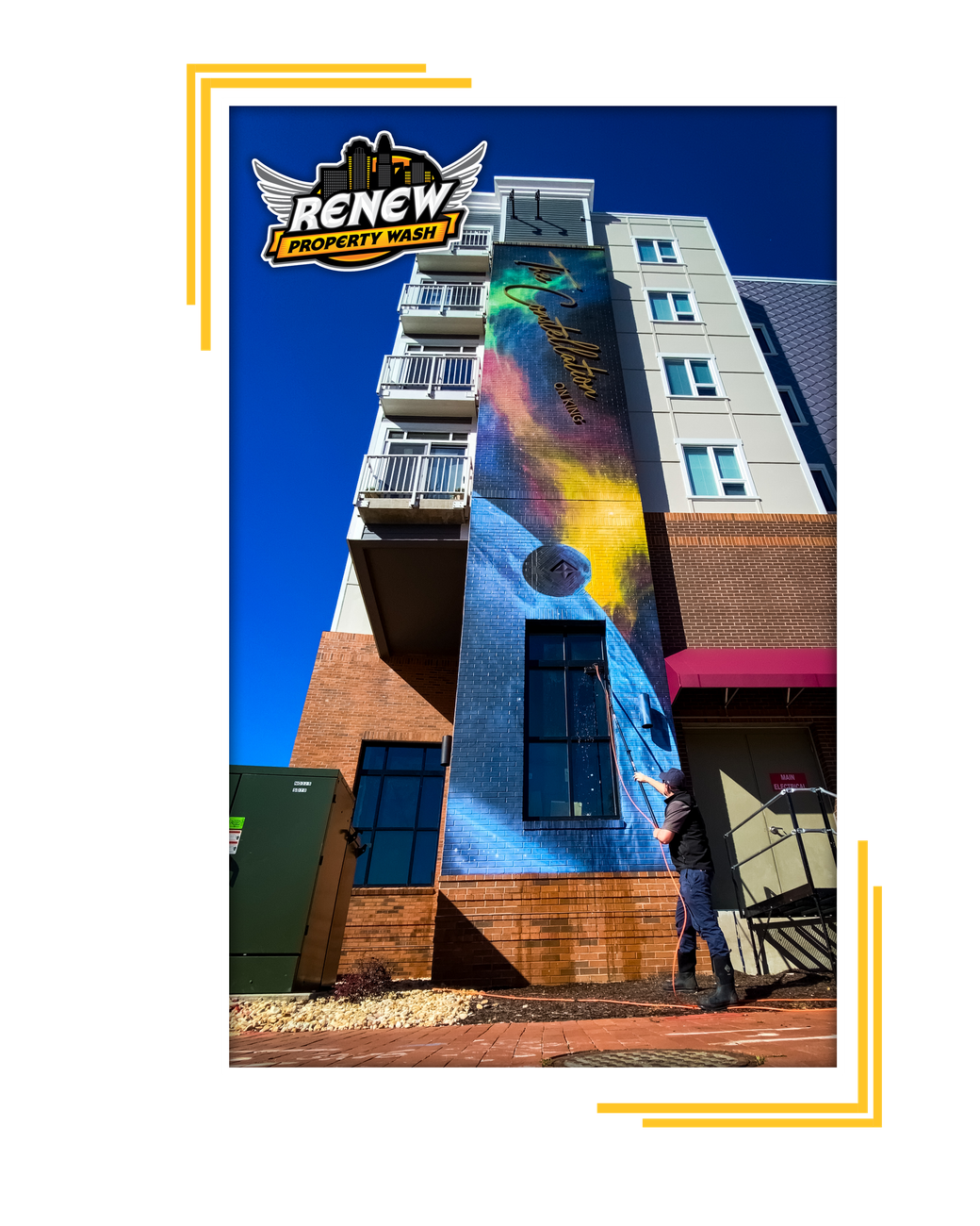 Commercial window cleaning in Hampton Roads, VA by Renew Property Wash working hard