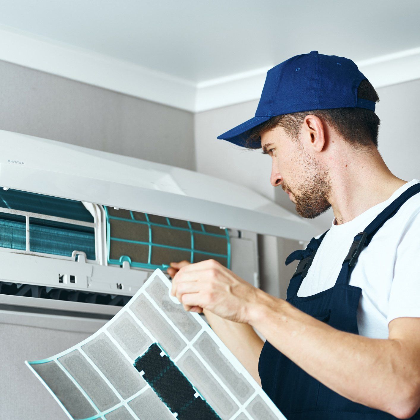 A professional doing home AC maintenance in Raleigh, NC