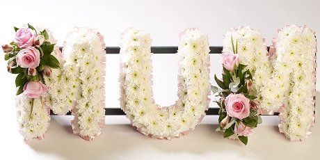 A flower arrangement spelling the word MUM
