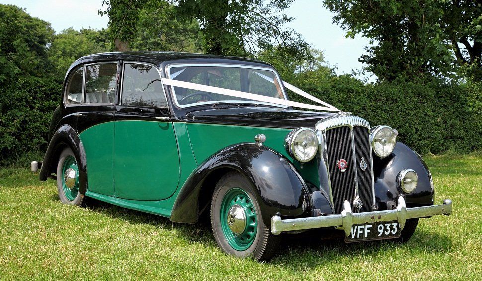 A green and black wedding car