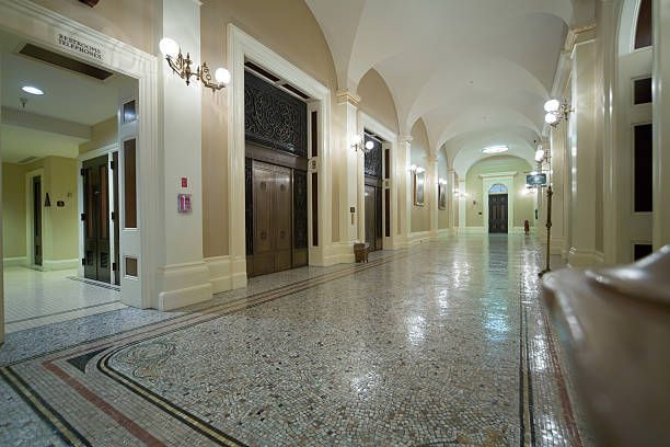 A long hallway with a fire extinguisher on the wall