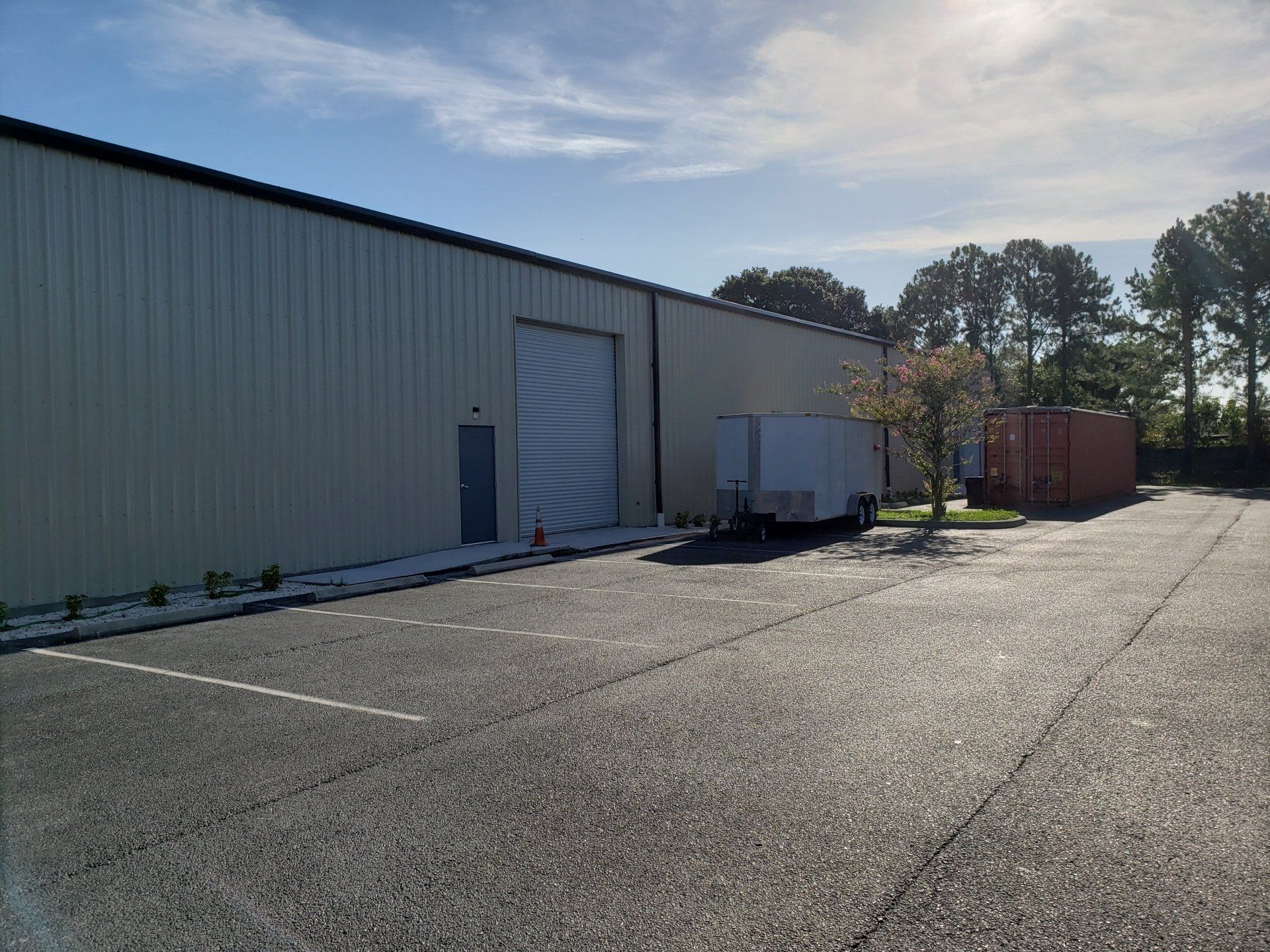 Man installing front store roof — Largo, FL — England Bros Construction