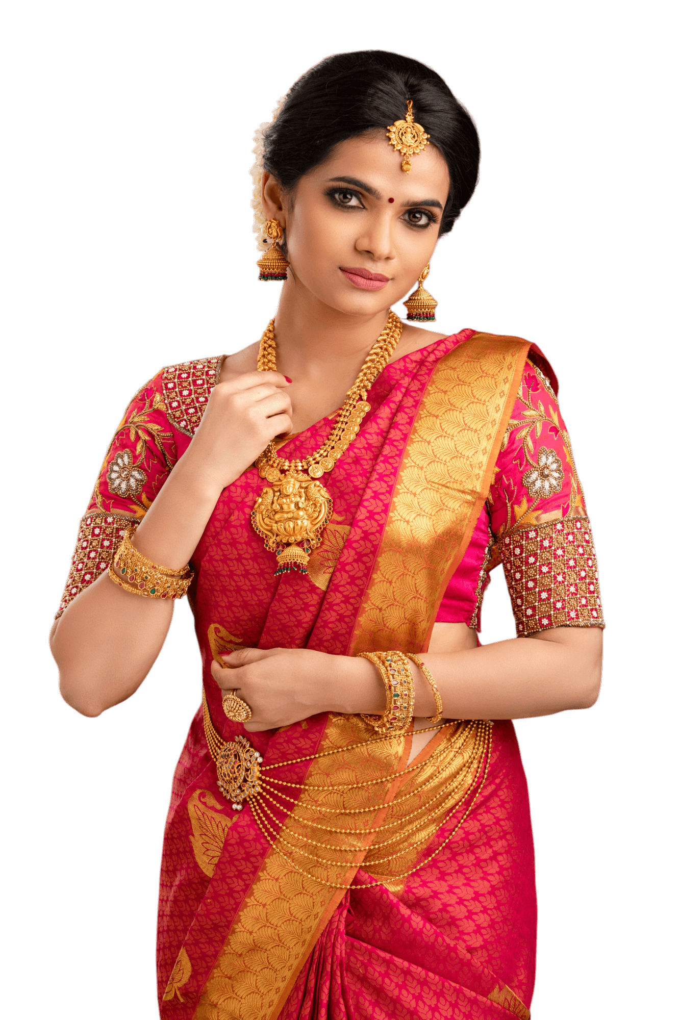 Woman in red sari and gold jewelry, posing.