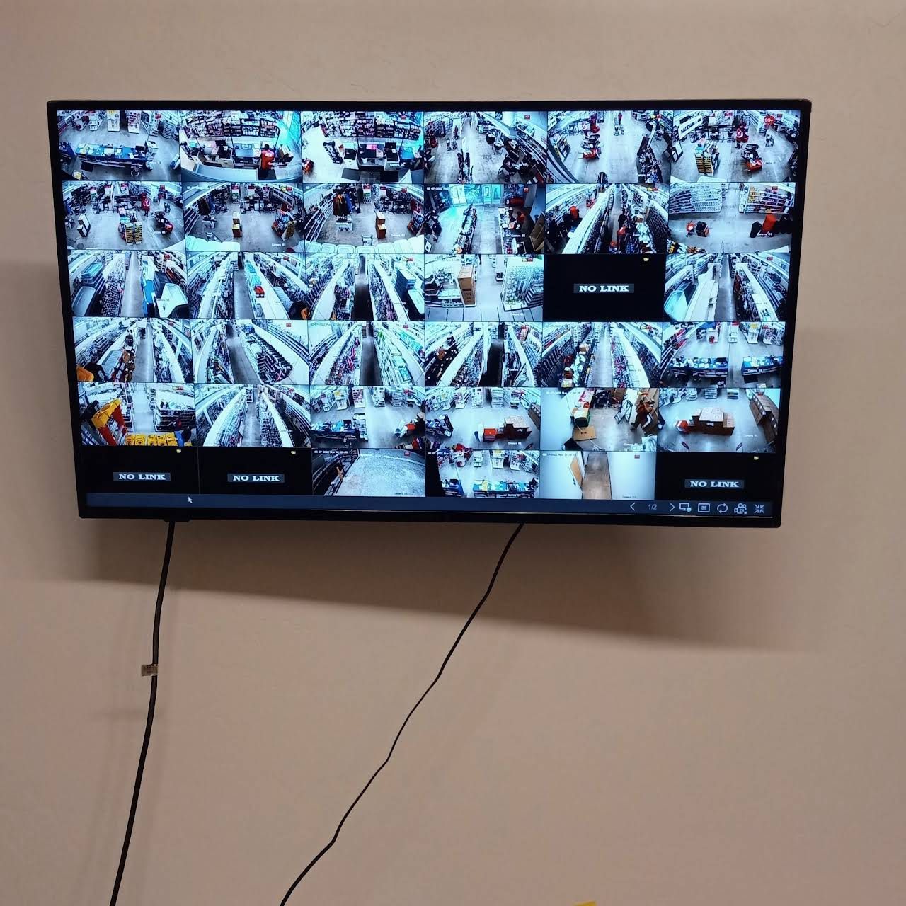 A large flat screen tv is mounted on a wall