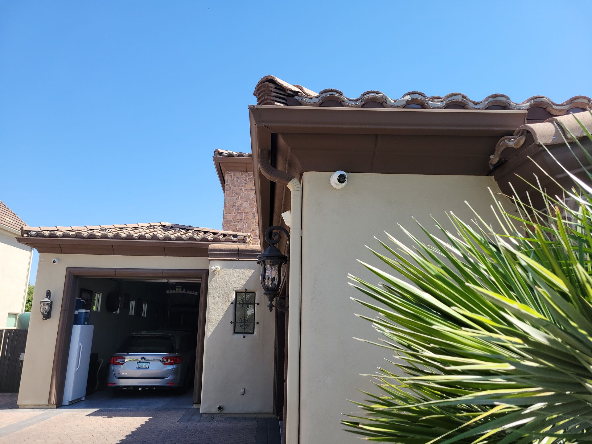 A car is parked in the garage of a house