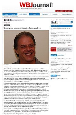 A man is smiling on a wb journal website.