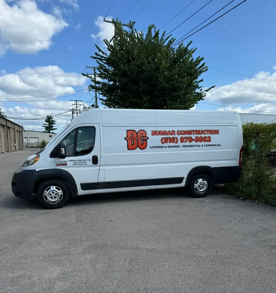 Burbar Construction service van parked at a commercial property