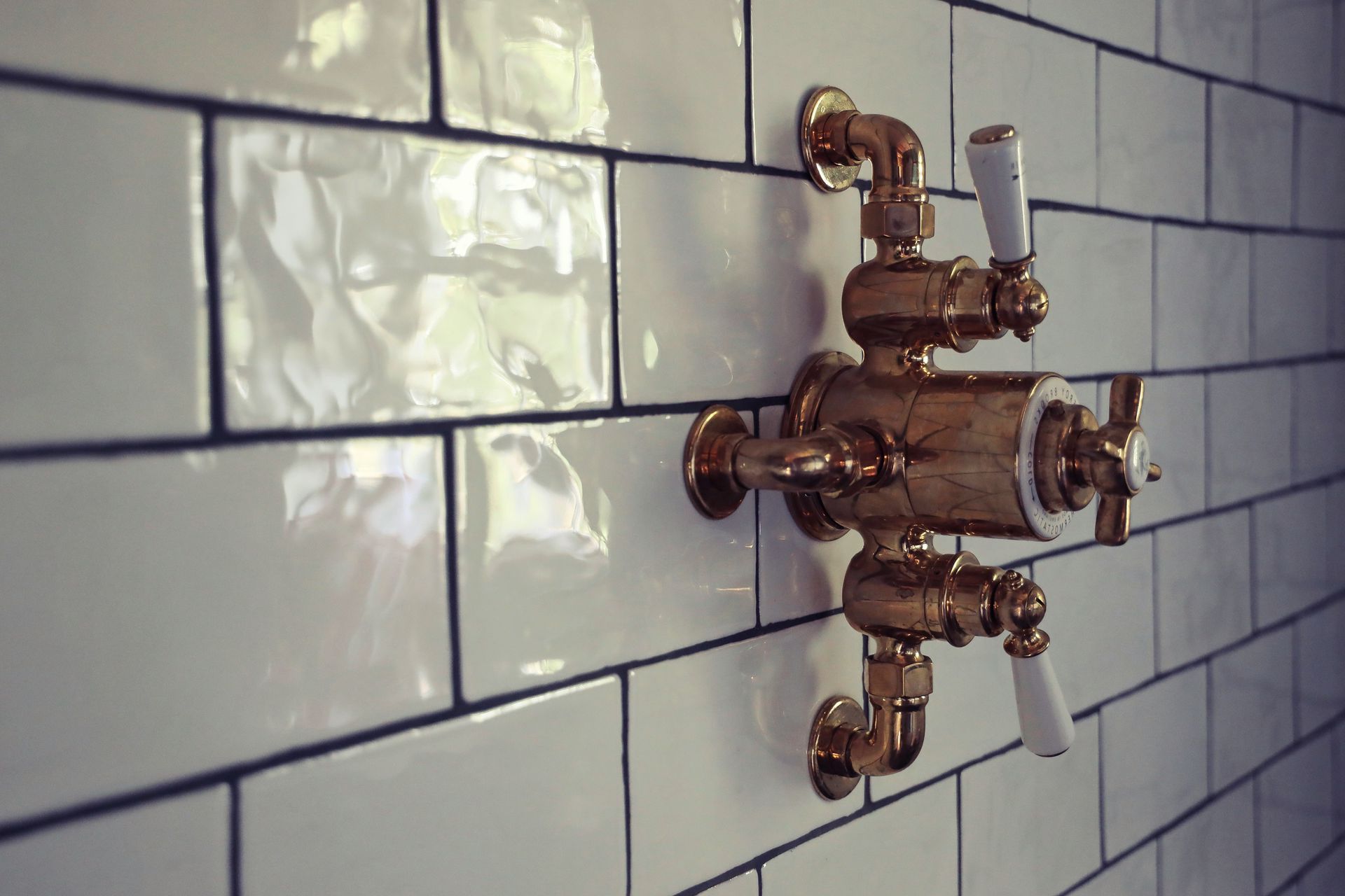 two men standing next to each other with their arms crossed