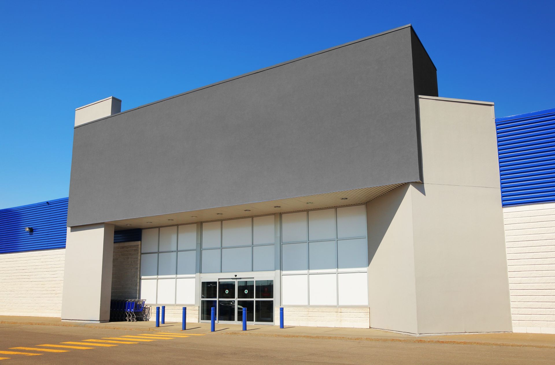 A large building with a blue and white striped roof