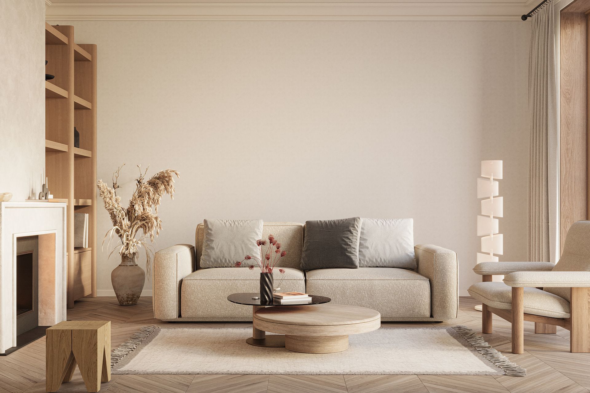 A living room with a couch , chair , coffee table and fireplace.
