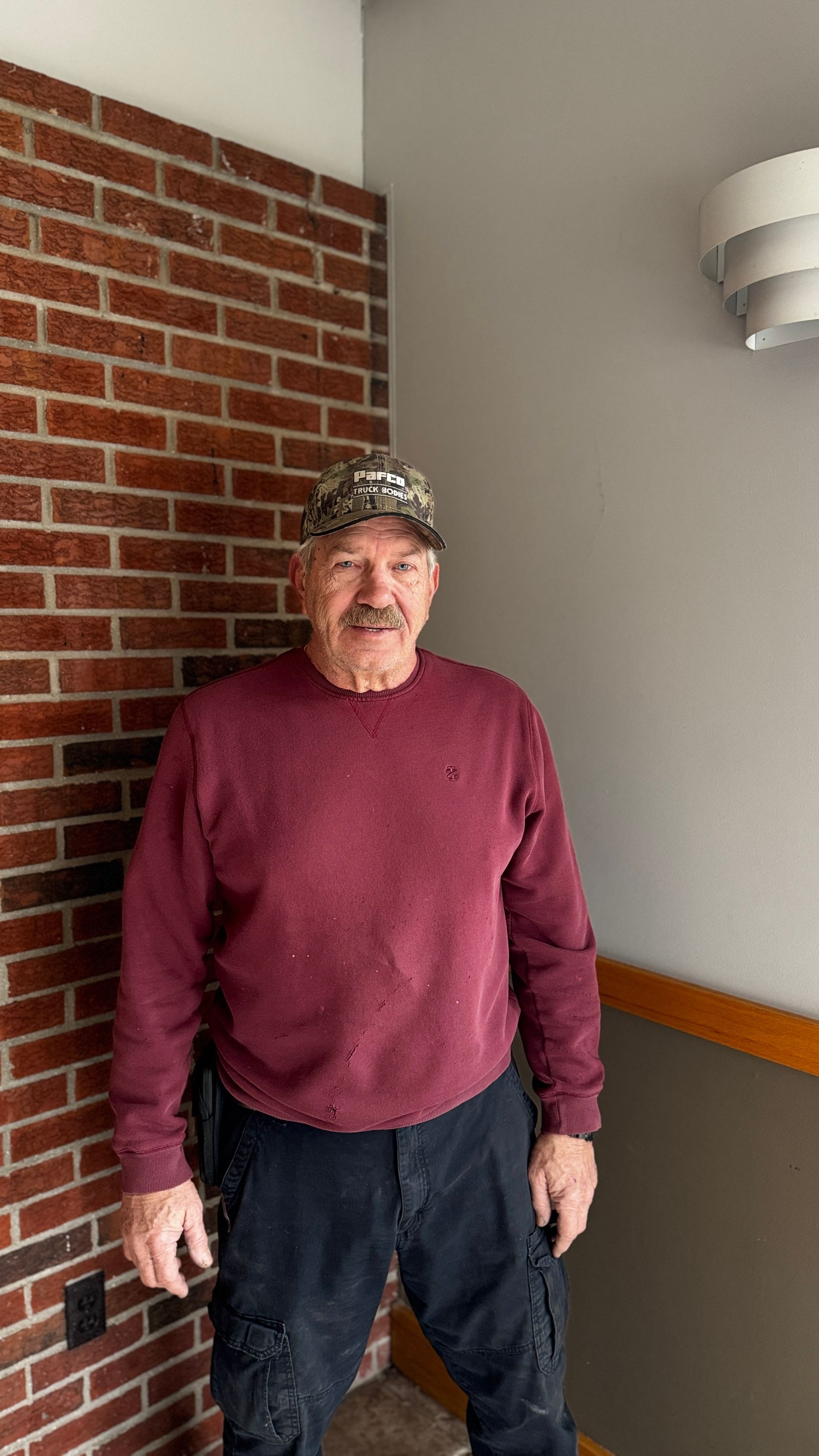 A man wearing sunglasses and a hat