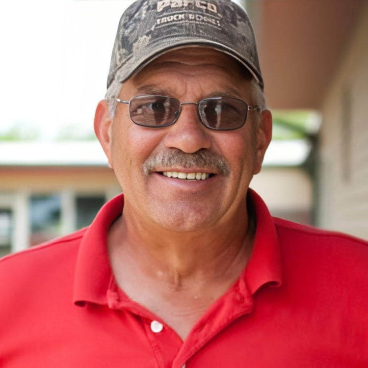 A man wearing sunglasses and a hat